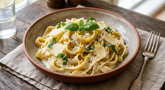 bowl with creamy lemon ricotta pasta with parmesan and basil